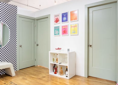 Stylish entryway at PALM venue, Montréal, Québec, CA with artwork and modern decor.