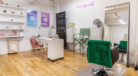 Modern beauty salon interior at PALM, Montréal, Québec, CA with stylish decor and seating arrangement.