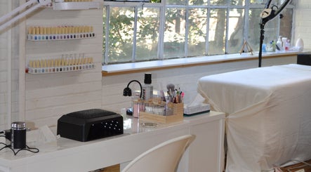 Beauty treatment area at Palm, Montréal, Québec, CA showcasing a serene setup with spa tools and comfortable seating.