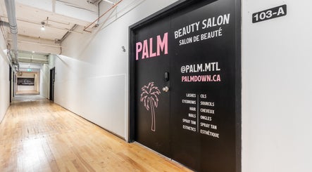 Palm beauty salon entrance located in a modern hallway in Montréal, Québec, CA.