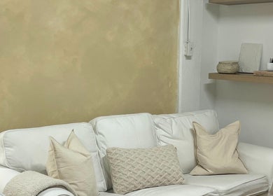 Elegant lounge area with white sofa and shelves at Palm, Montréal, Québec, CA.