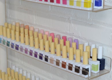 Vibrant nail polish display at Palm, Montréal, Québec, CA showcasing diverse colors.