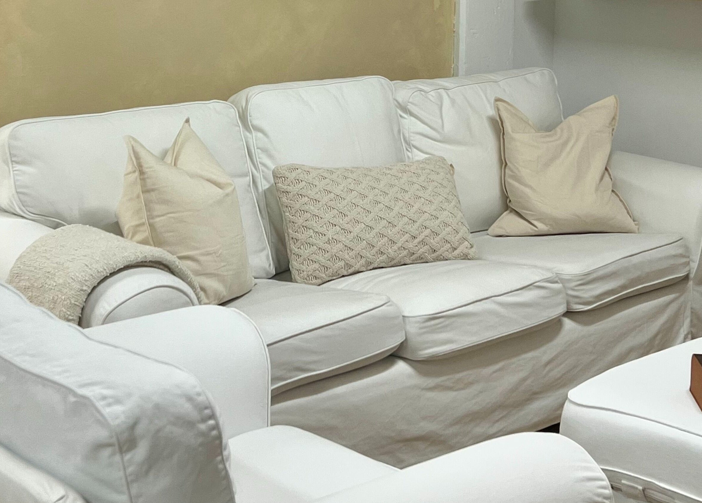 Relaxing white sofa area at Palm venue, Montréal, Québec, CA, perfect for unwinding in style and comfort.