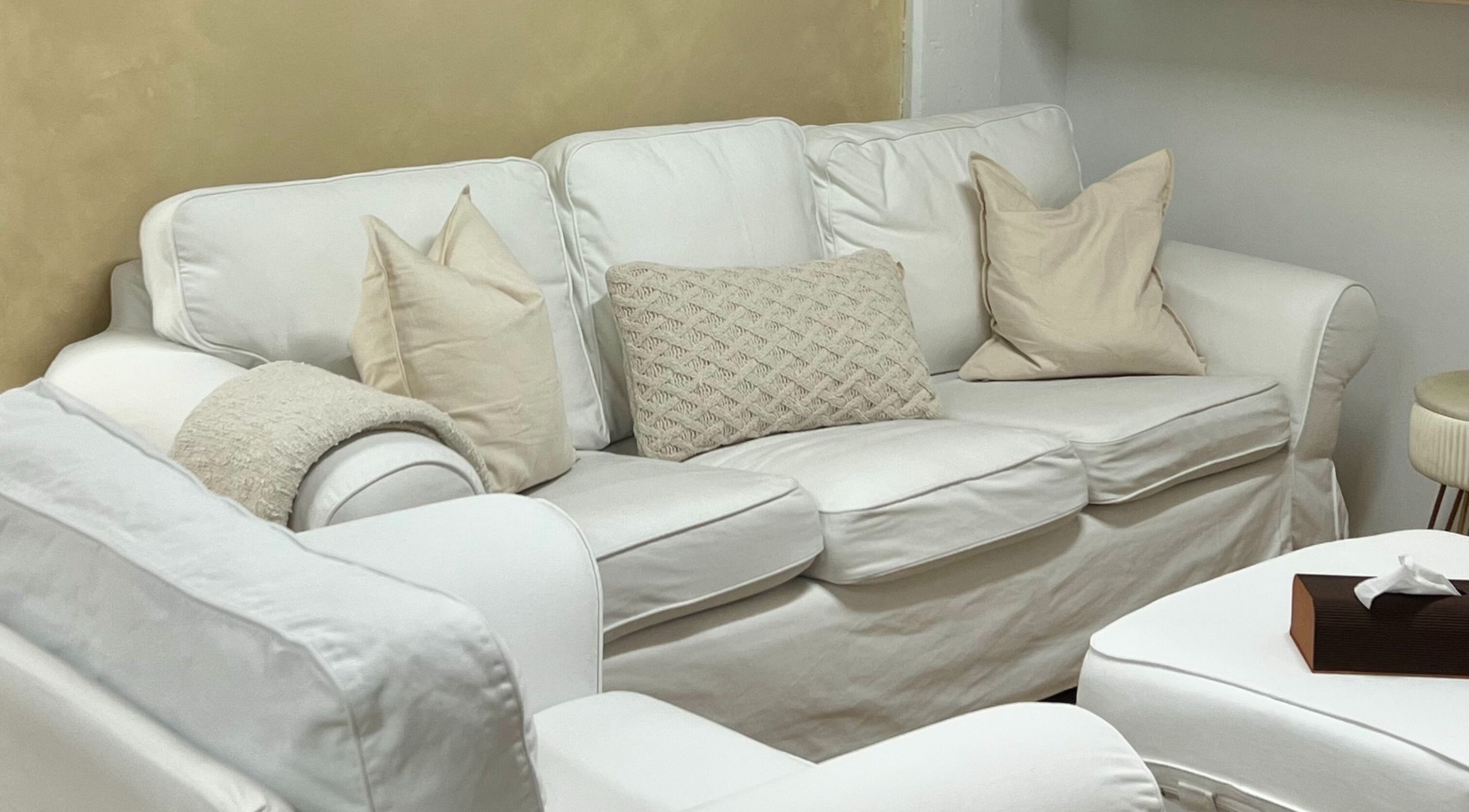 Relaxing white sofa area at Palm venue, Montréal, Québec, CA, perfect for unwinding in style and comfort.