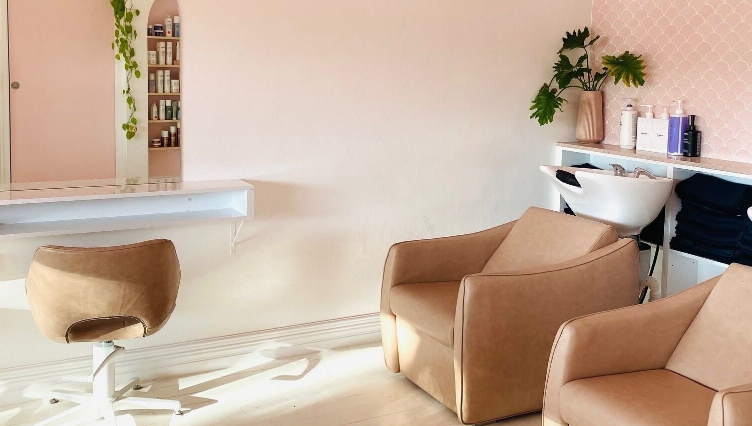 Cozy salon chairs and modern decor at Studio Black Innaloo, Innaloo, Western Australia, AU.