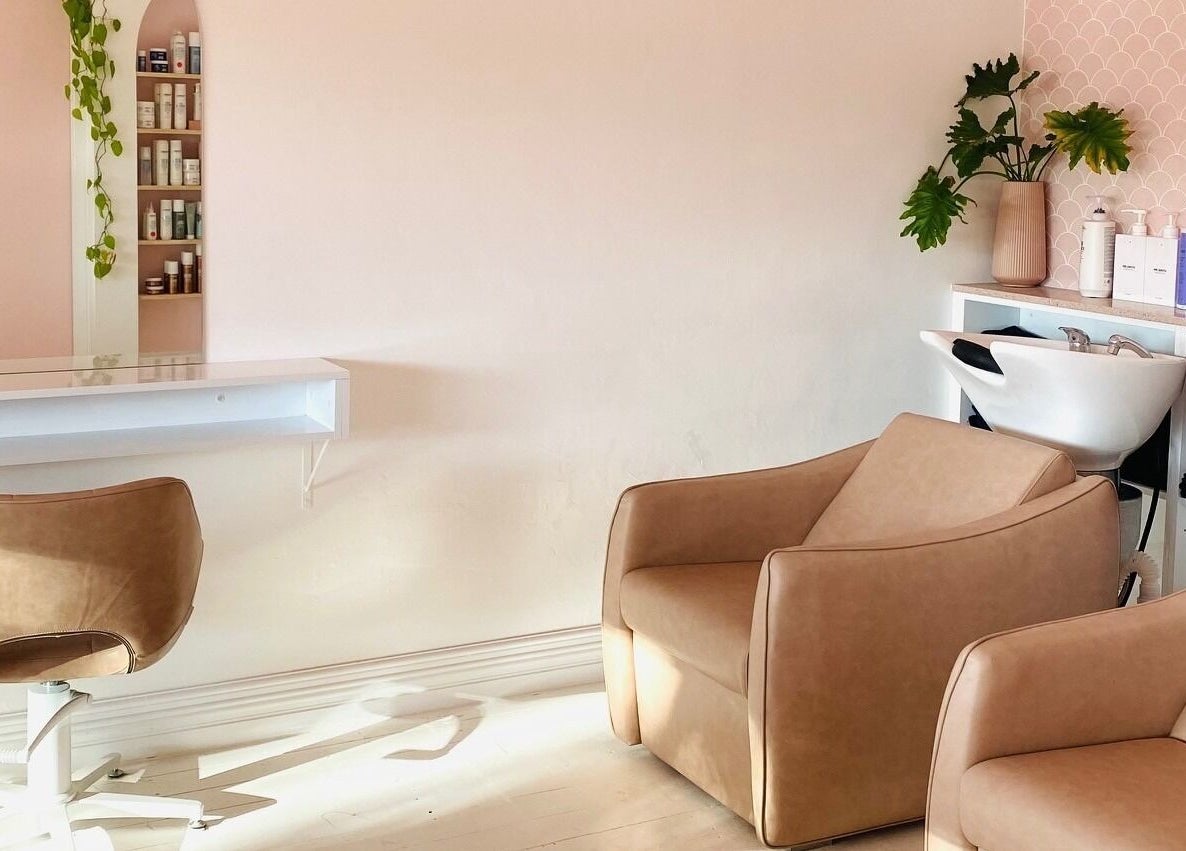 Cozy salon chairs and modern decor at Studio Black Innaloo, Innaloo, Western Australia, AU.