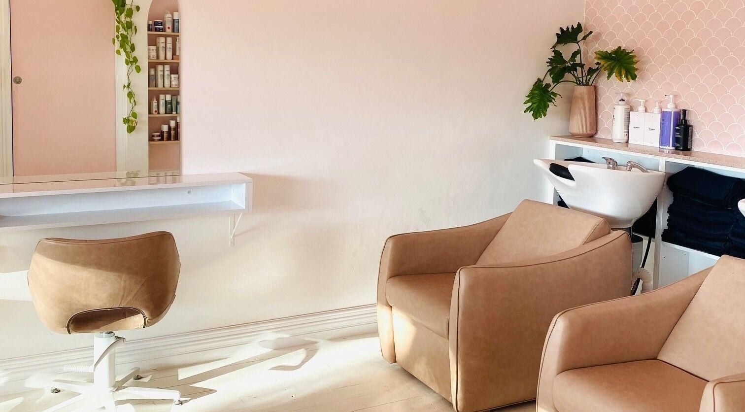 Cozy salon chairs and modern decor at Studio Black Innaloo, Innaloo, Western Australia, AU.