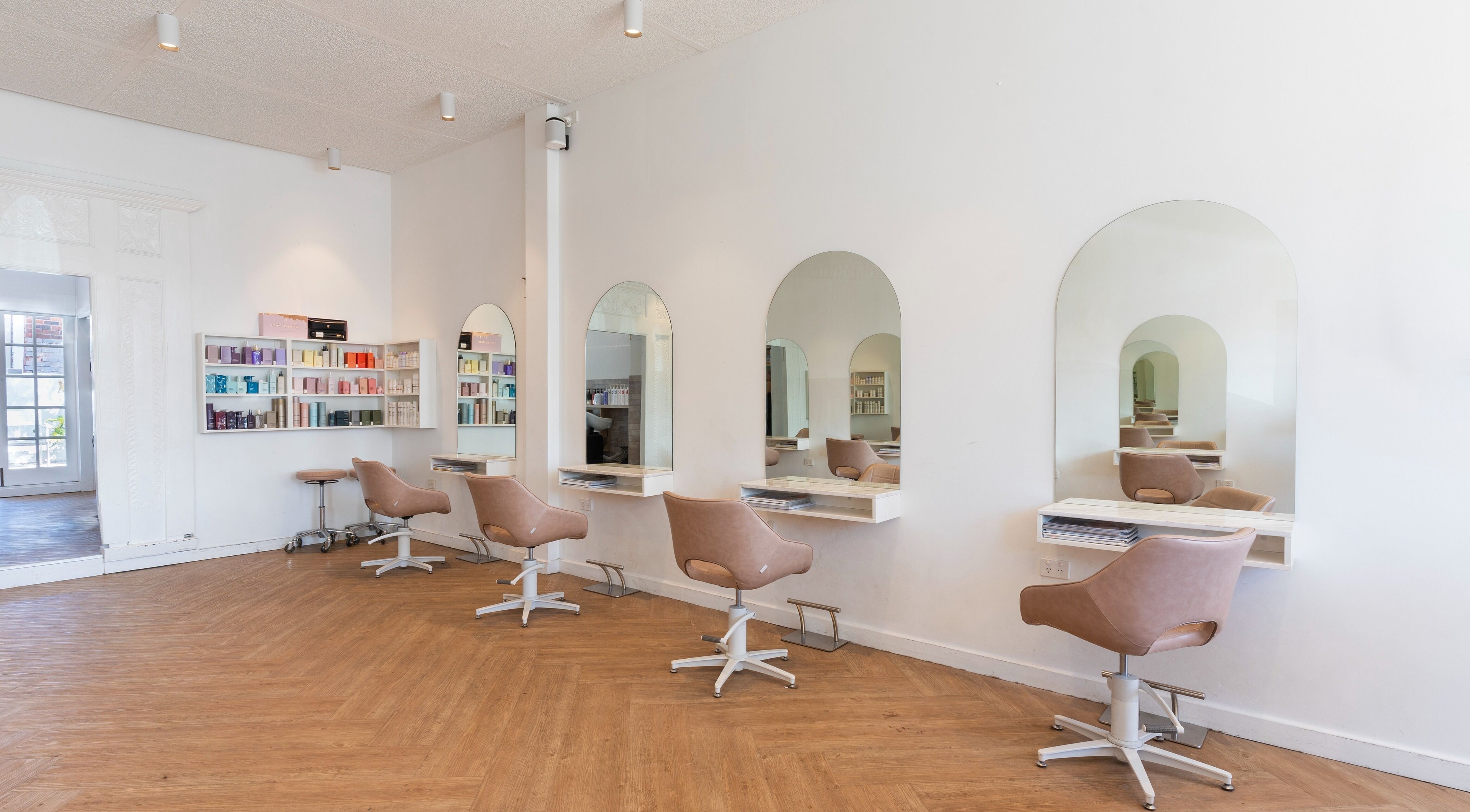Modern styling chairs and mirrors at Studio Black Cottesloe in Cottesloe, Western Australia, AU.