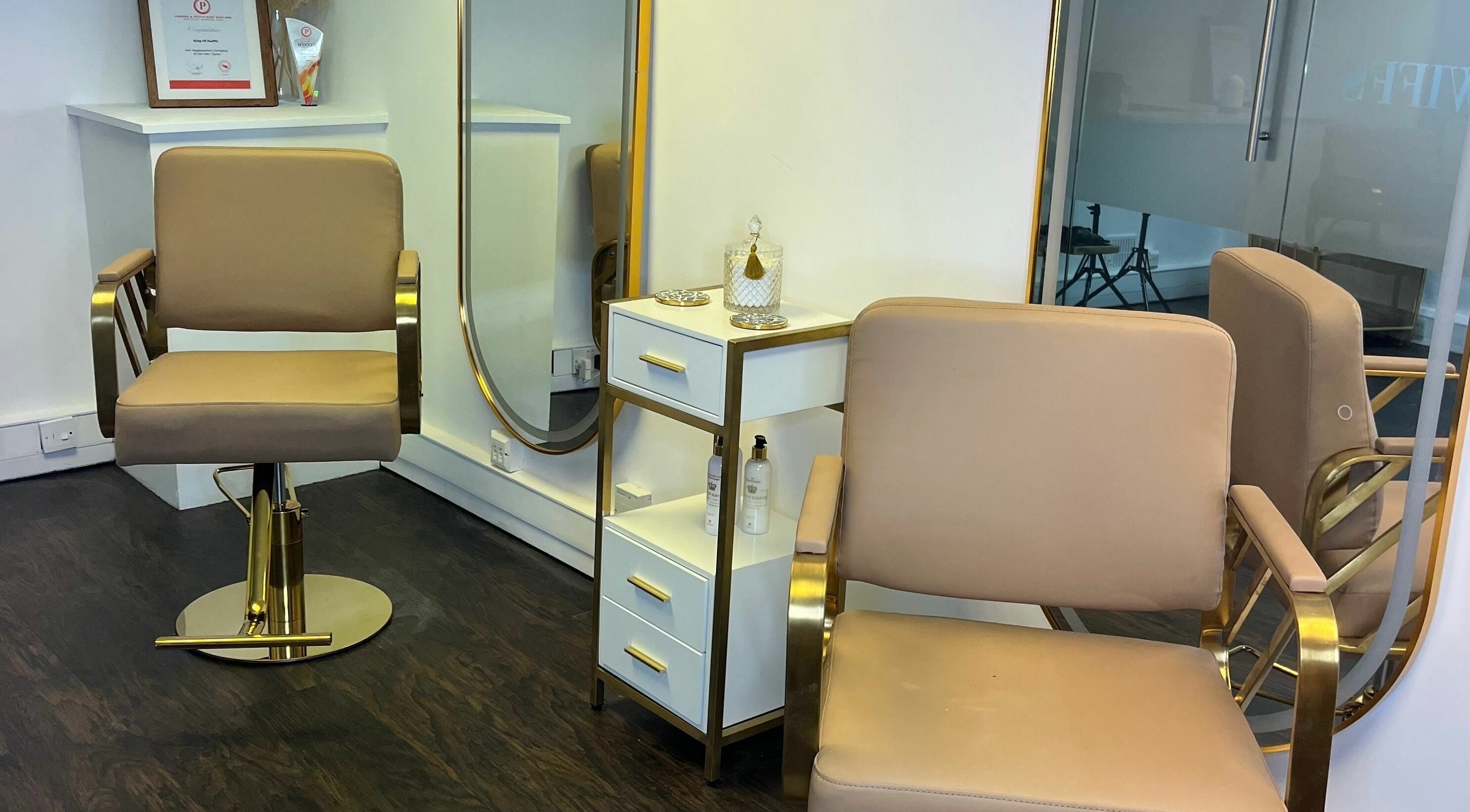 Elegant salon chair and mirror at Kings of Kwiffs Essex, Witham, England, GB.