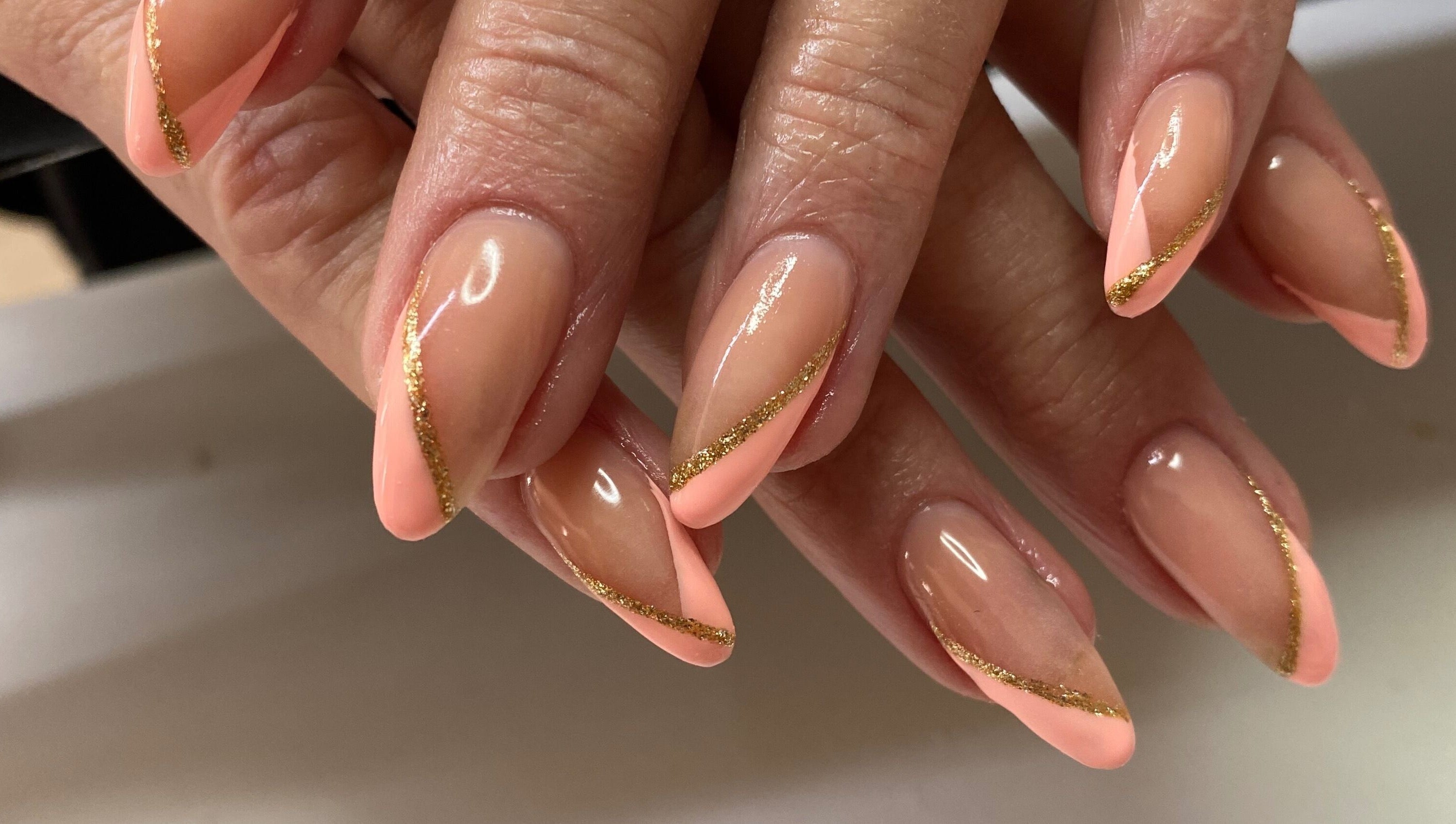 Elegant nails with pink and gold design at Infinite, Benoni, Gauteng, ZA.