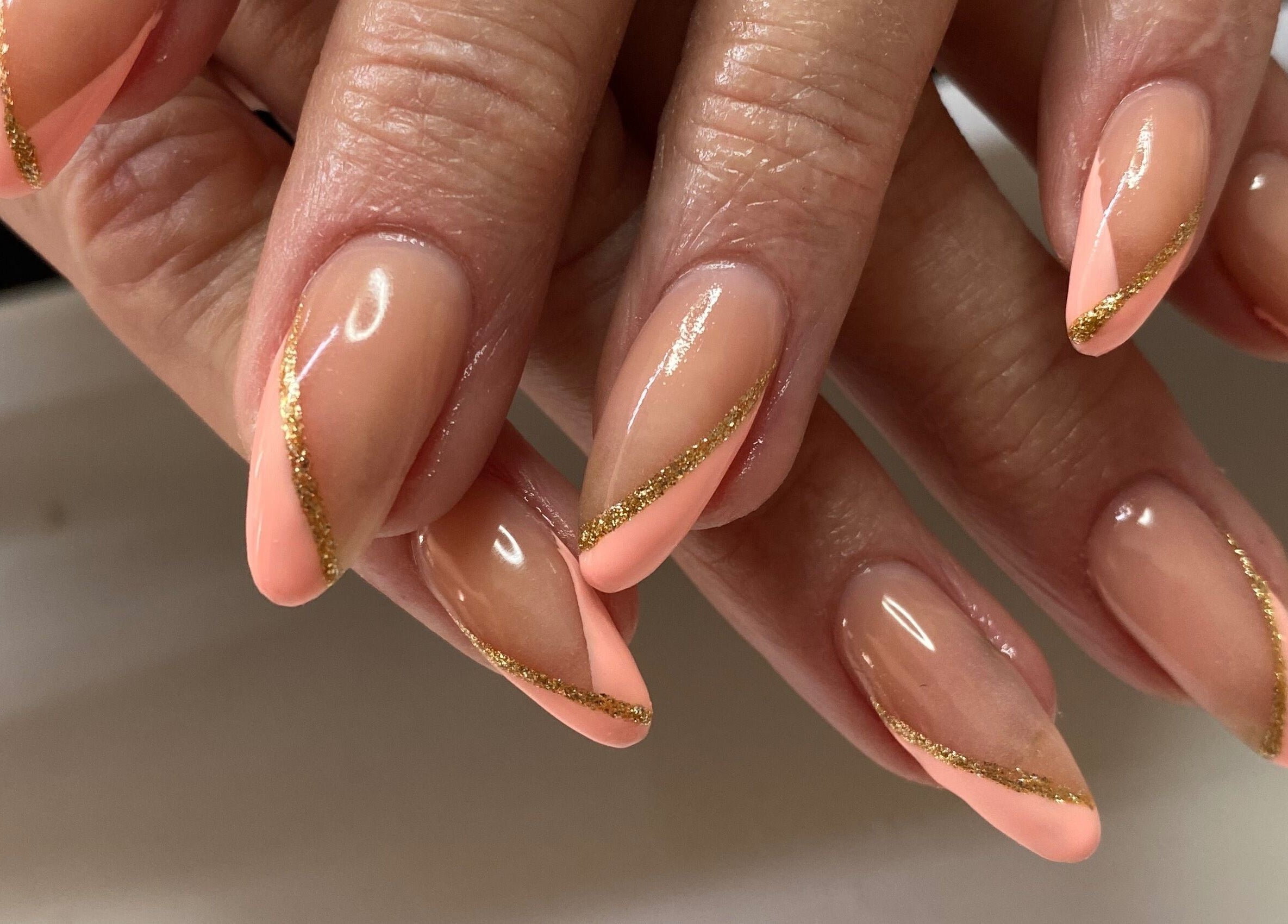 Elegant nails with pink and gold design at Infinite, Benoni, Gauteng, ZA.