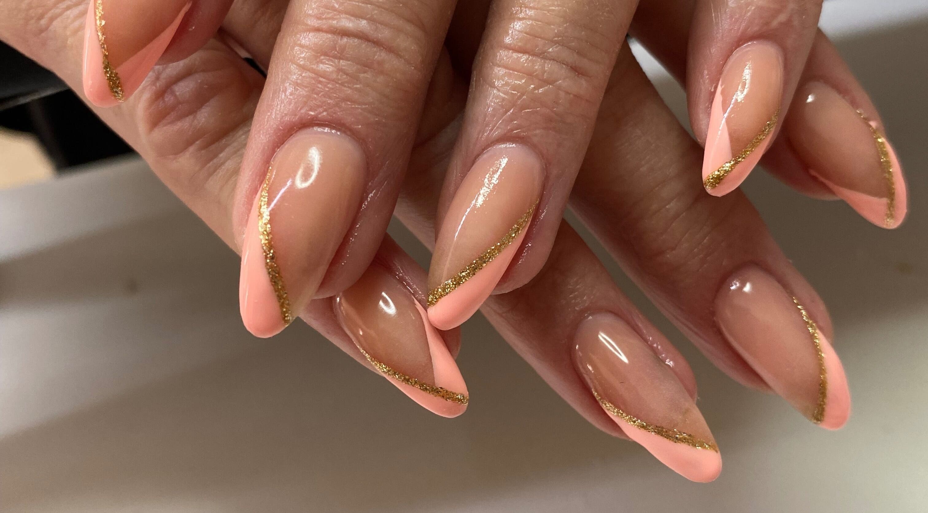 Elegant nails with pink and gold design at Infinite, Benoni, Gauteng, ZA.