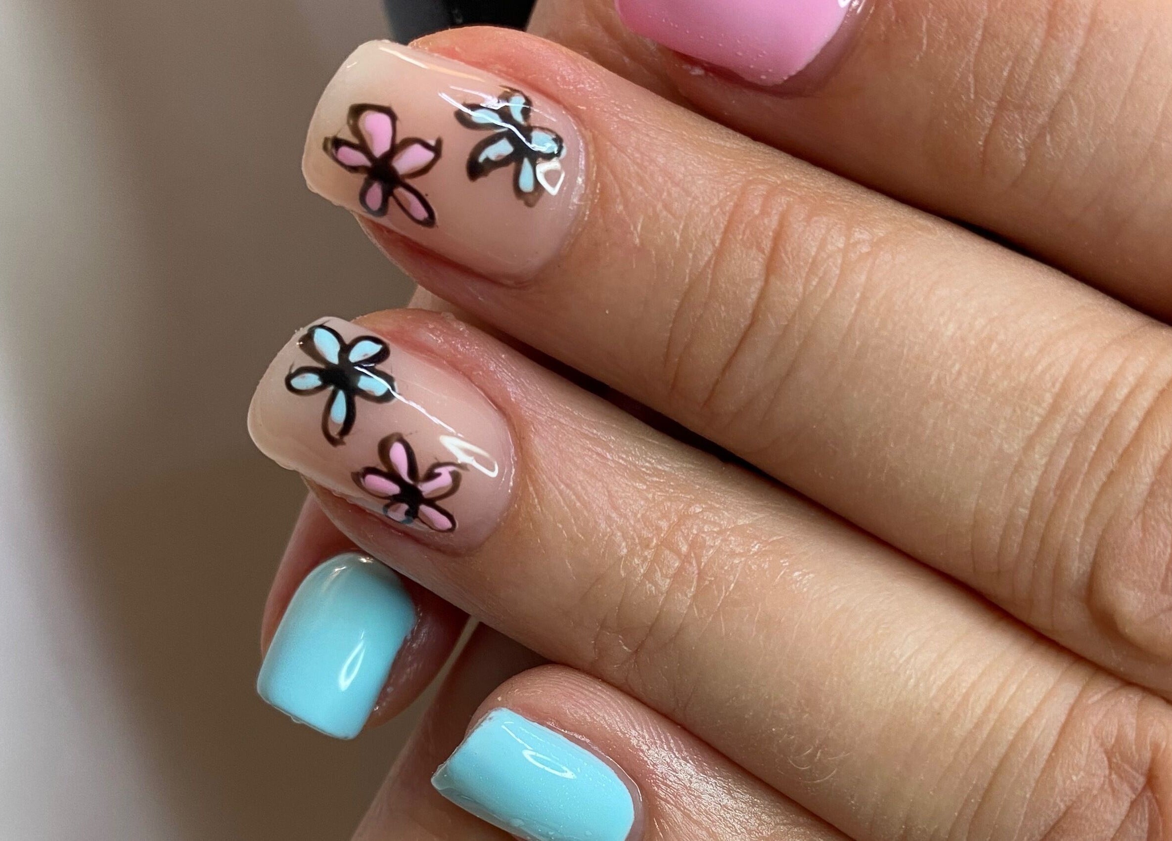Floral nail art with pastel colors at Infinite, Benoni, Gauteng, ZA, showcasing delicate flower designs.