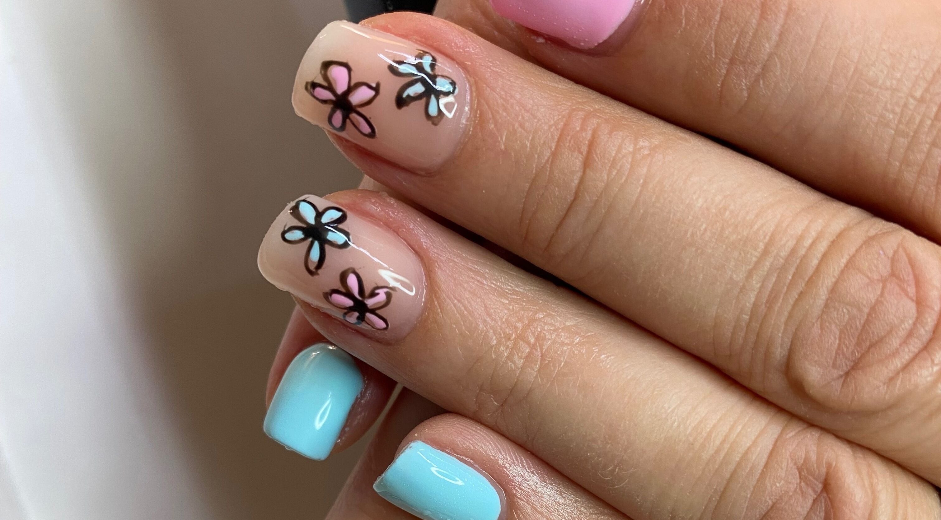 Floral nail art with pastel colors at Infinite, Benoni, Gauteng, ZA, showcasing delicate flower designs.