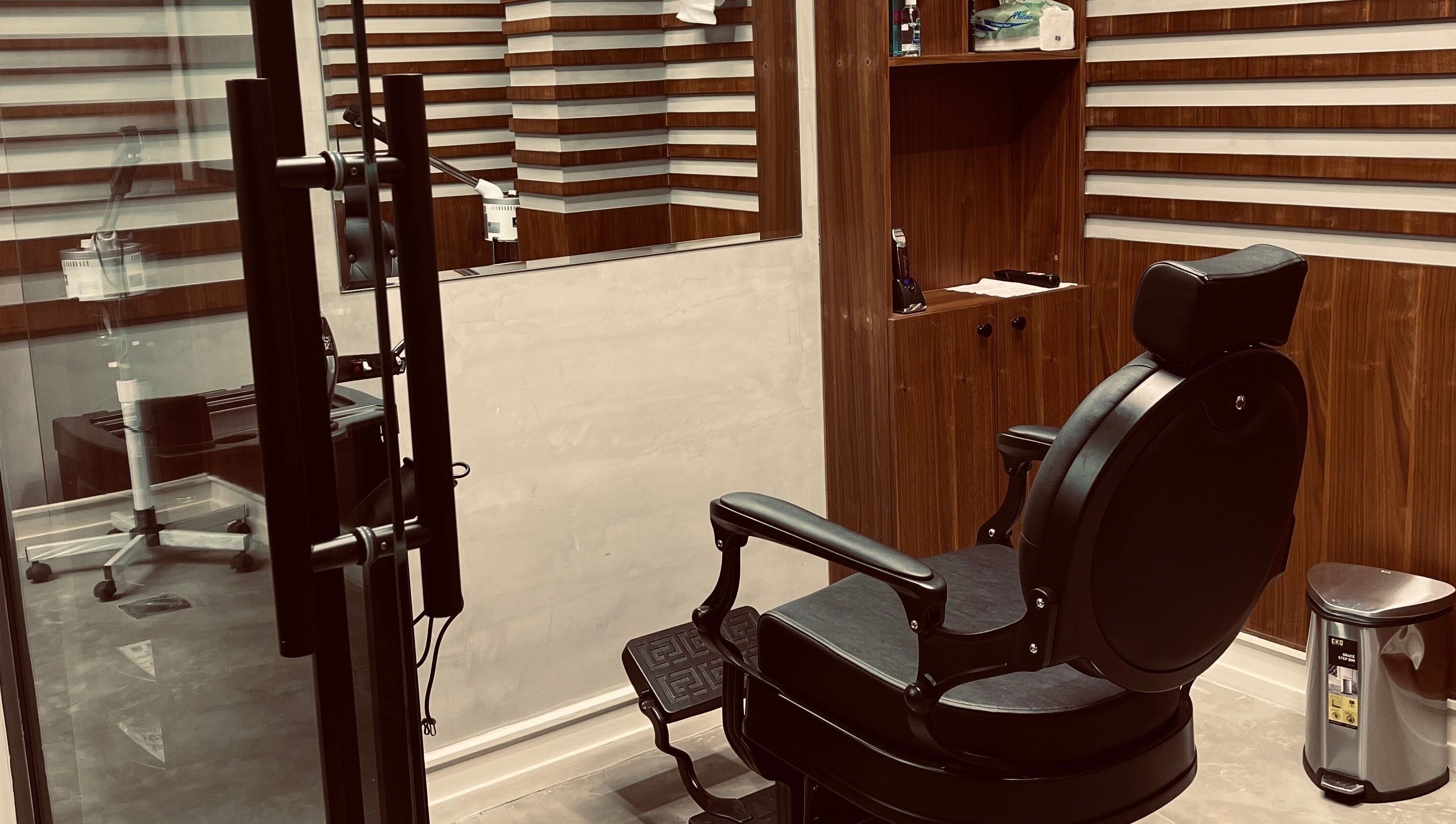 Cozy barber chair at Harmonic Barbershop - Al Malqa in Riyadh, Riyadh Province, SA reflecting modern style.