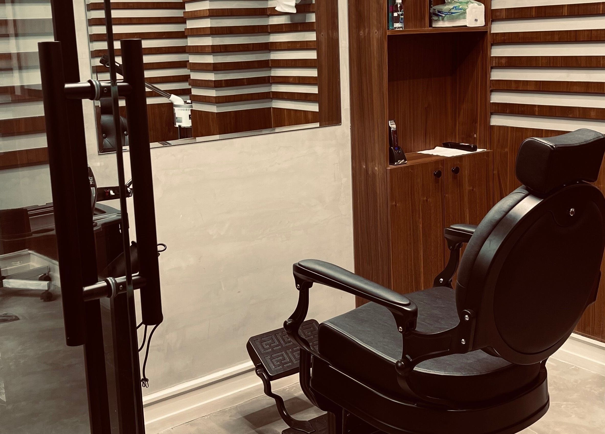 Cozy barber chair at Harmonic Barbershop - Al Malqa in Riyadh, Riyadh Province, SA reflecting modern style.