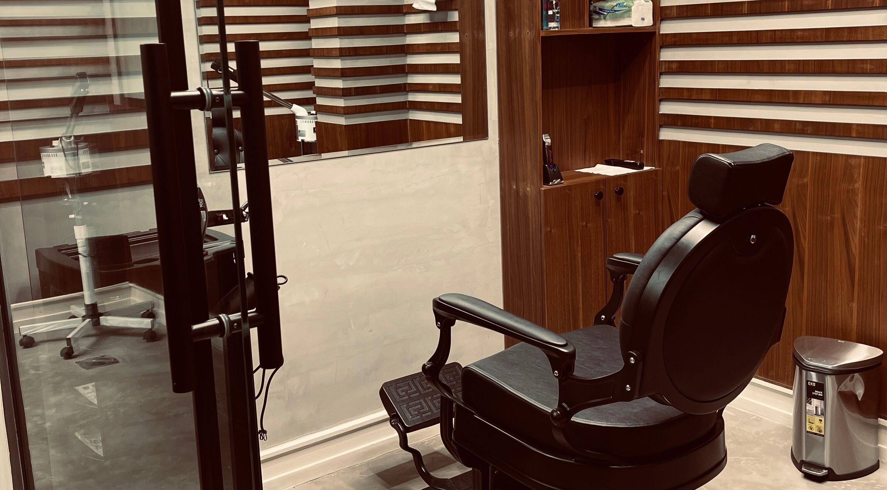Cozy barber chair at Harmonic Barbershop - Al Malqa in Riyadh, Riyadh Province, SA reflecting modern style.