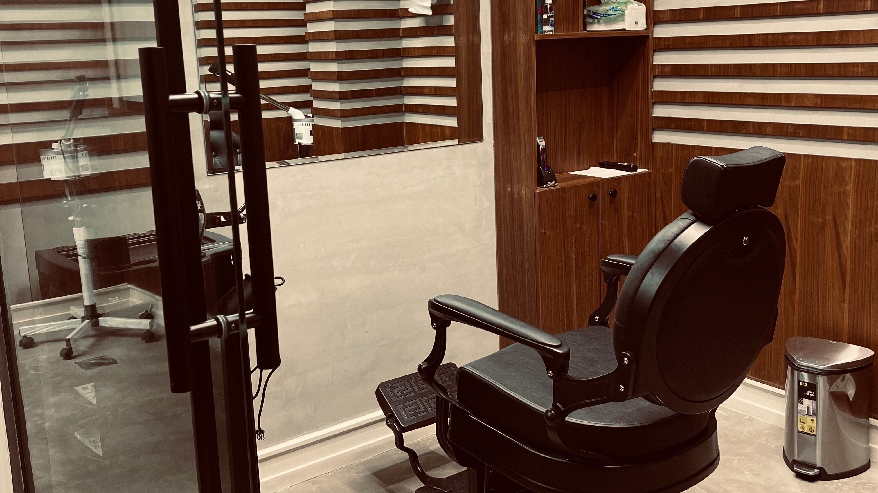 Cozy barber chair at Harmonic Barbershop - Al Malqa in Riyadh, Riyadh Province, SA reflecting modern style.
