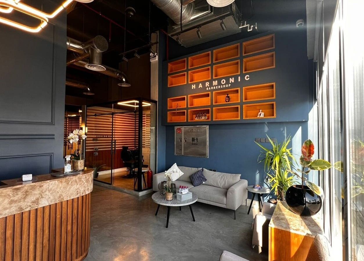 Chic interior of Harmonic Barbershop - Al Malqa in Riyadh, Riyadh Province, SA with modern seating and stylish decor.