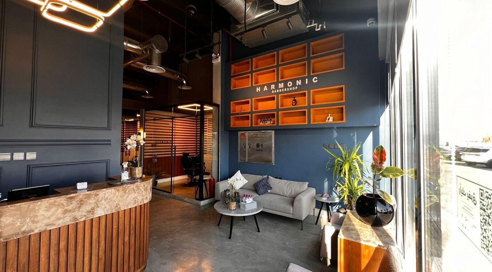 Chic interior of Harmonic Barbershop - Al Malqa in Riyadh, Riyadh Province, SA with modern seating and stylish decor.