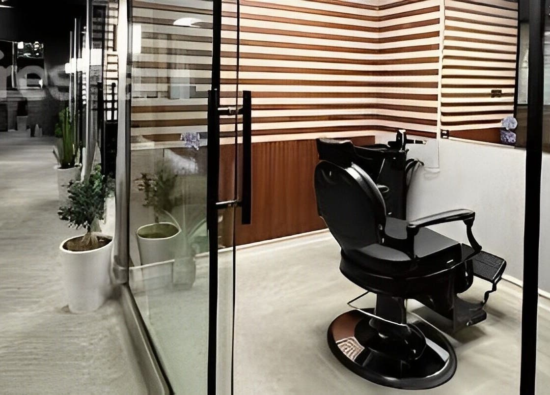 Luxurious barber chair at Harmonic Barbershop - Al Malqa, Riyadh, Riyadh Province, SA, inviting modern style.