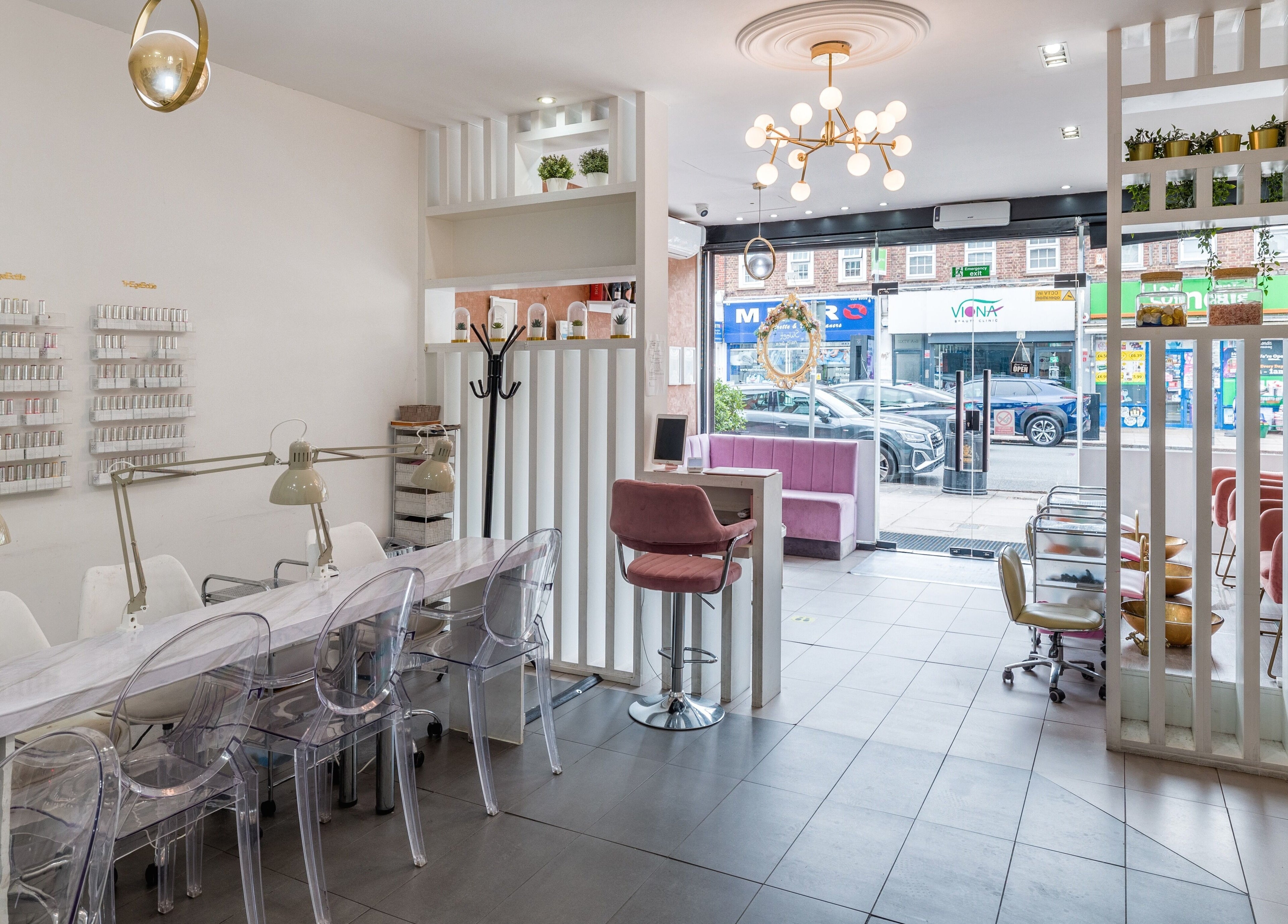 Interior of Blush Nail Bar in London, England, GB, showcasing stylish seating and modern decor.