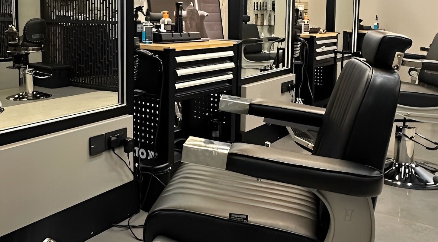 Modern barber chair at Bulls and Barbers in Dubai, Dubai, AE, showcasing sleek and stylish interior design.