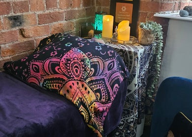 Cozy reiki room at Lynne Helliwell Reiki Training Holistic Coaching, Hypnotherapy, Failsworth, England, GB with vibrant decor.
