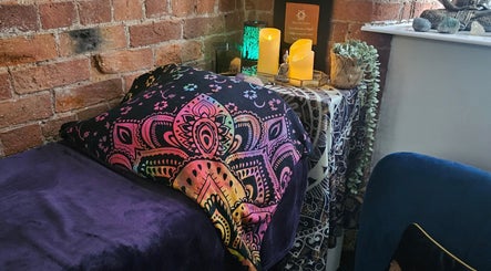 Cozy reiki room at Lynne Helliwell Reiki Training Holistic Coaching, Hypnotherapy, Failsworth, England, GB with vibrant decor.