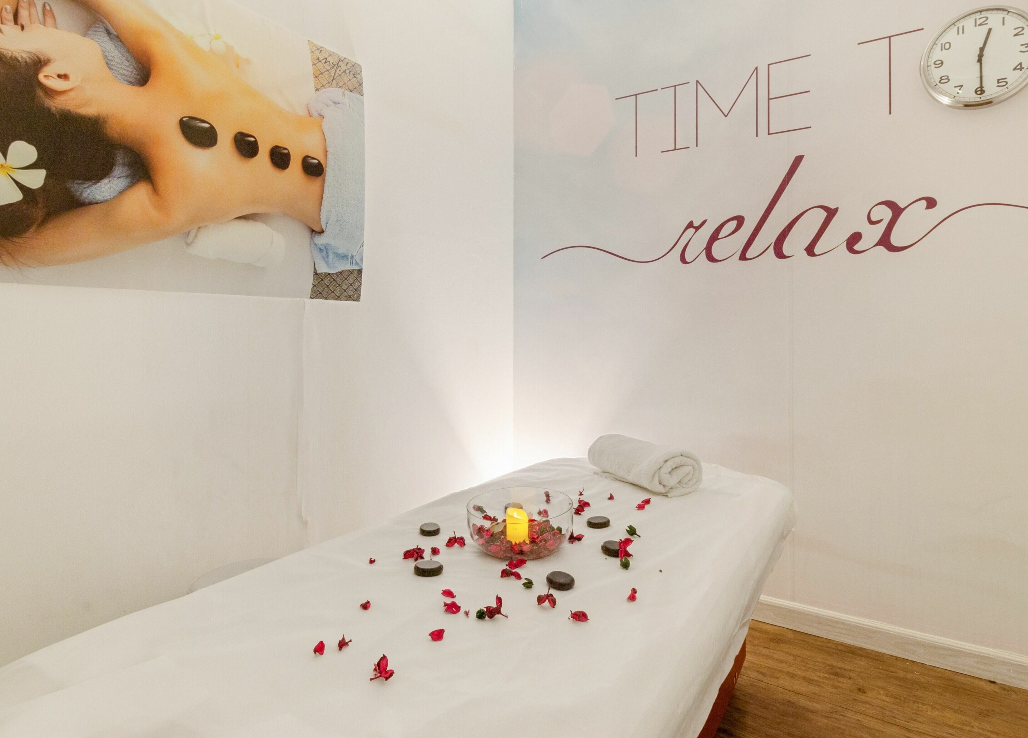 Serene massage room at Inspire Spa, Abu Dhabi, AE with soothing decor and massage bed.