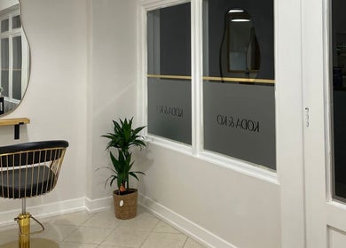 Megan Gribbon Hair salon interior in Torquay, England, GB, featuring modern decor and stylish seating.