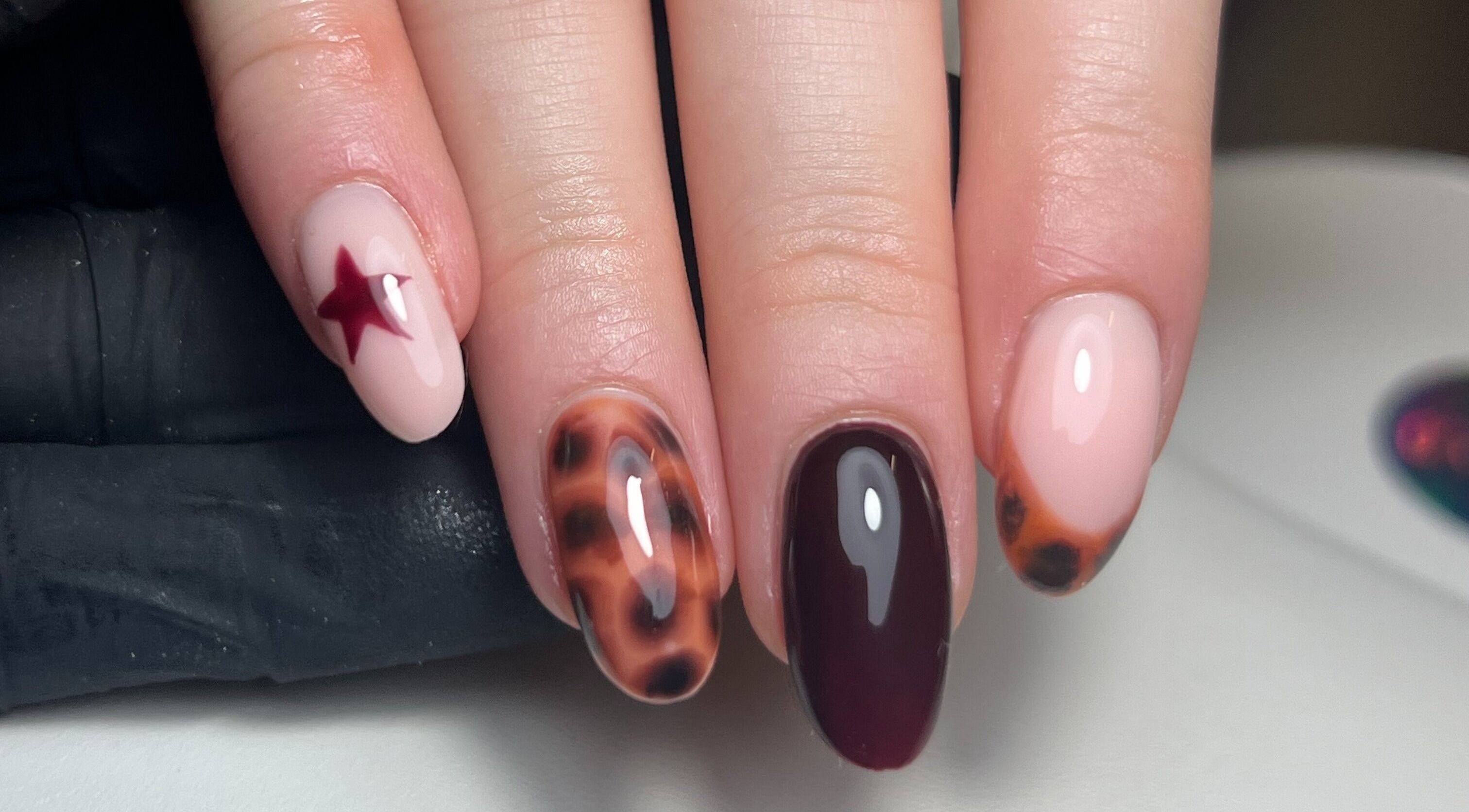 Unique nail art with star and tortoiseshell design by By Brooke Coles, Blackwood, Wales, GB.