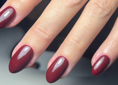 Elegant maroon nails at By Brooke Coles, Blackwood, Wales, GB, showcasing a glossy finish.