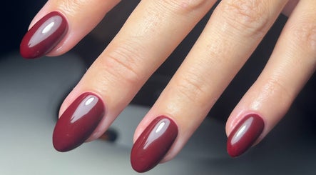 Elegant maroon nails at By Brooke Coles, Blackwood, Wales, GB, showcasing a glossy finish.