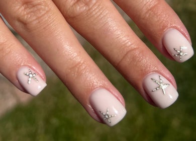 Elegant manicure by Brooke Coles at Blackwood, Wales, GB featuring star-studded nail design.