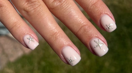 Elegant manicure by Brooke Coles at Blackwood, Wales, GB featuring star-studded nail design.