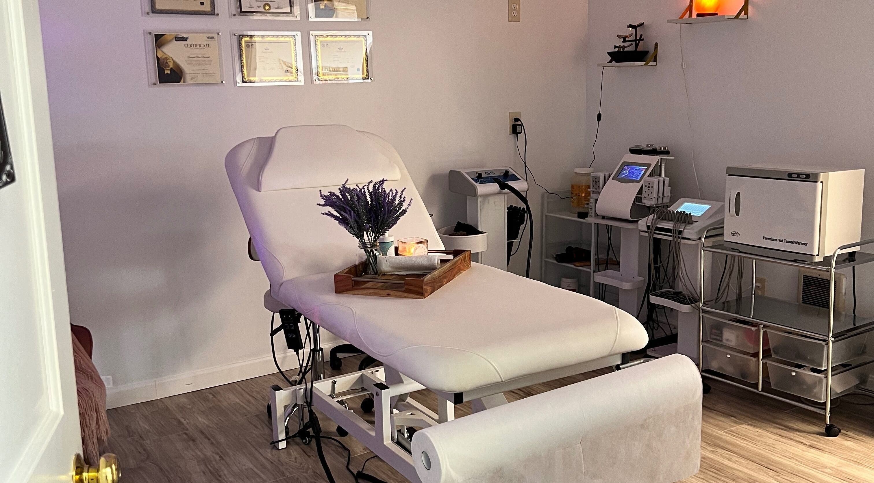 Relaxing spa room at Brazilian Beauty Spa in Peabody, Massachusetts, US with a massage table and soft lighting.