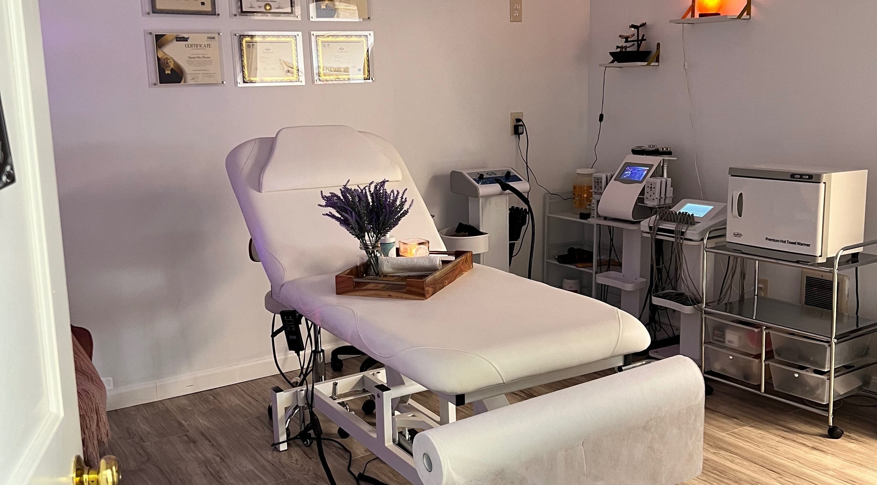 Relaxing spa room at Brazilian Beauty Spa in Peabody, Massachusetts, US with a massage table and soft lighting.