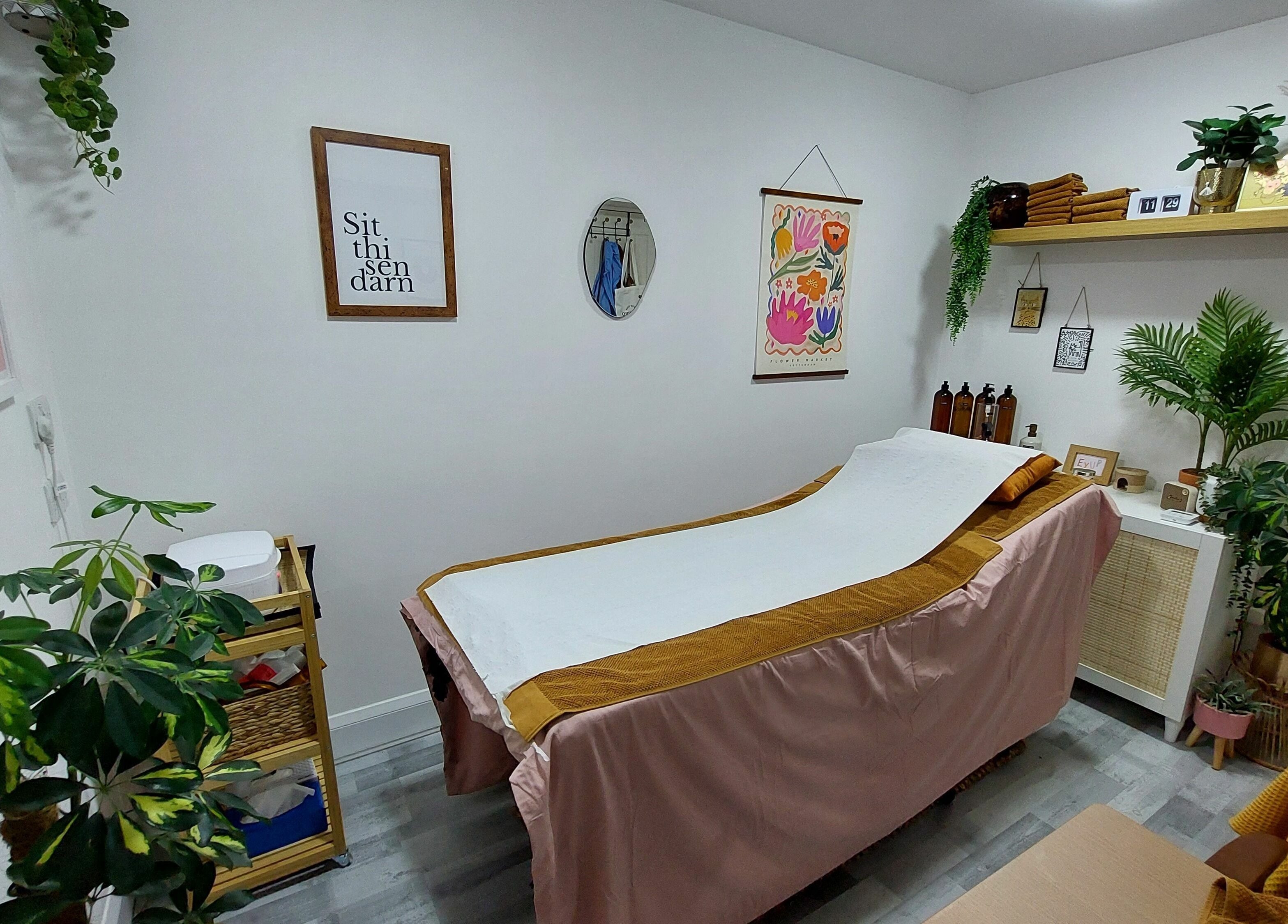 Relaxing therapy room at T'Studio, Basingstoke, England, GB with cozy décor and a comfortable treatment bed.