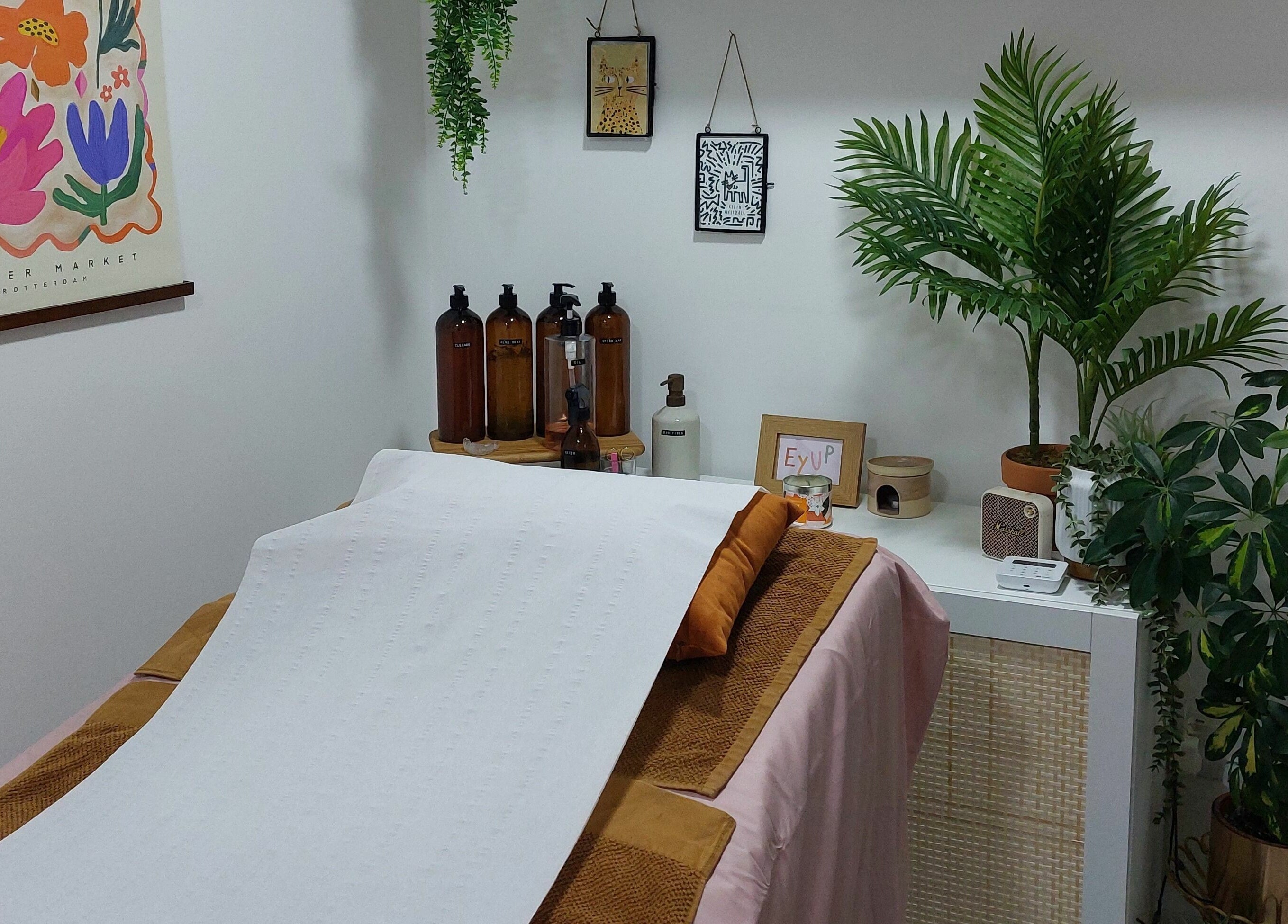 Calm spa room at T'Studio, Basingstoke, England, GB with massage bed and serene decor.