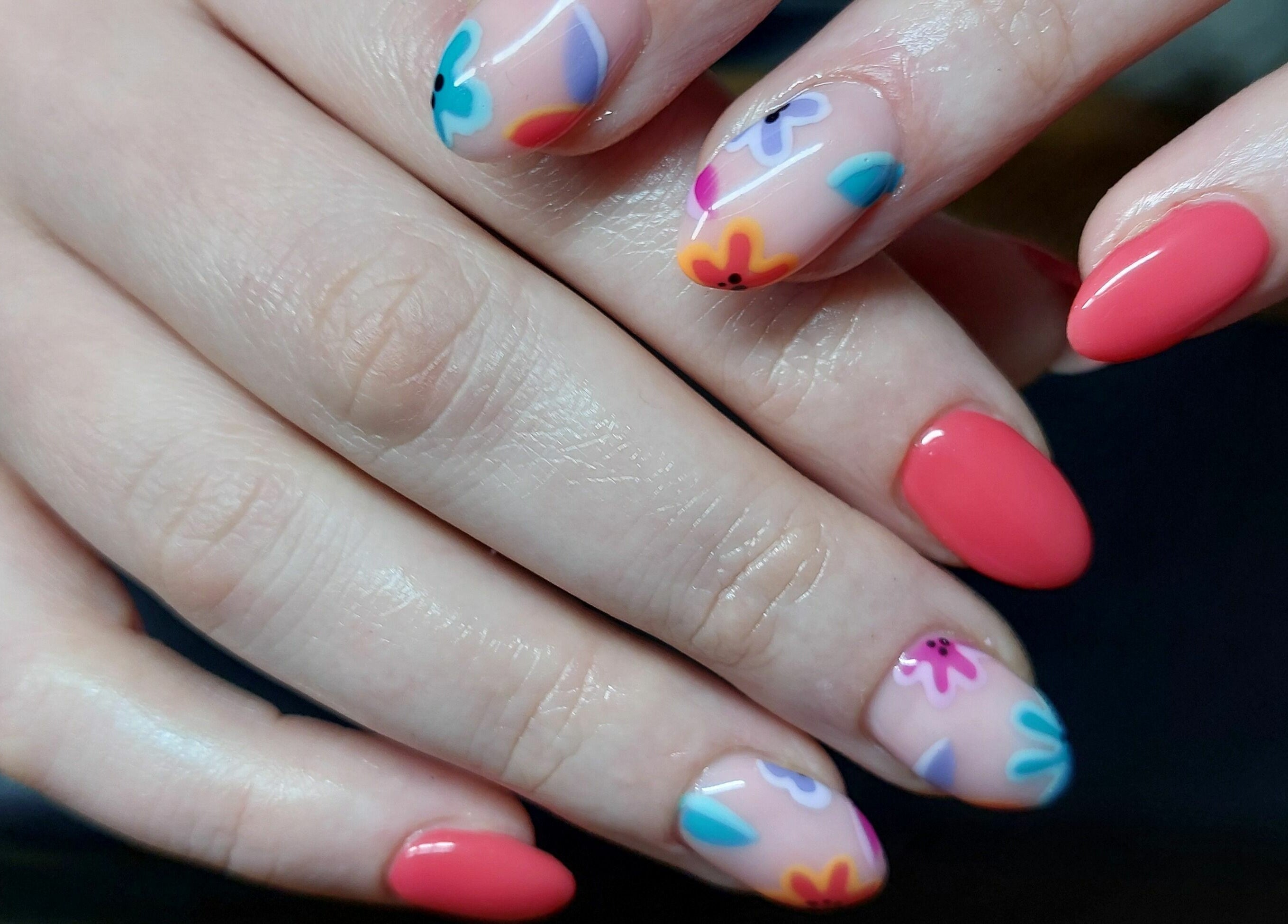 Vibrant floral nail art at T'Studio, Basingstoke, England, GB showcasing expert craftsmanship.