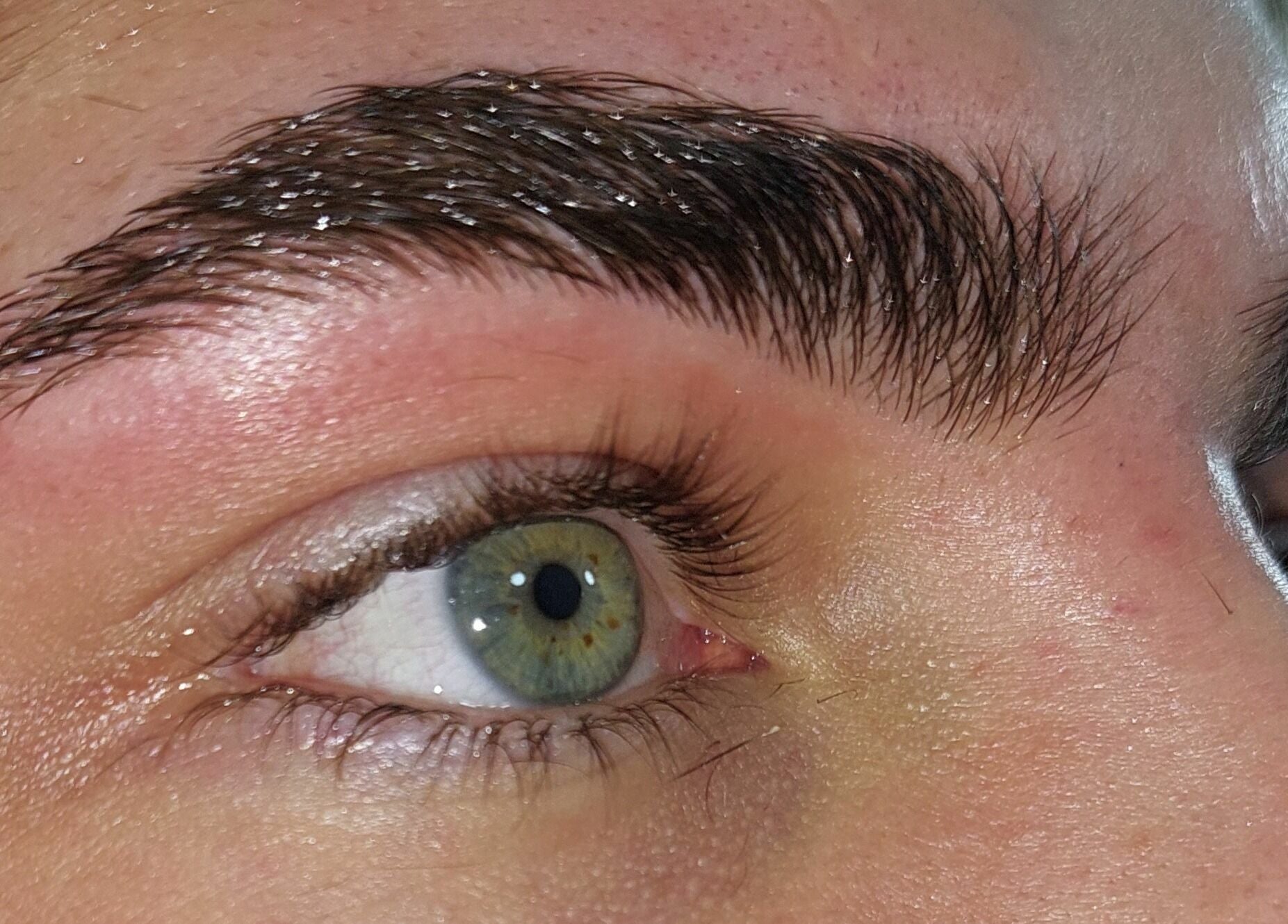 Close-up of expertly shaped eyebrow and eye at T'Studio in Basingstoke, England, GB.