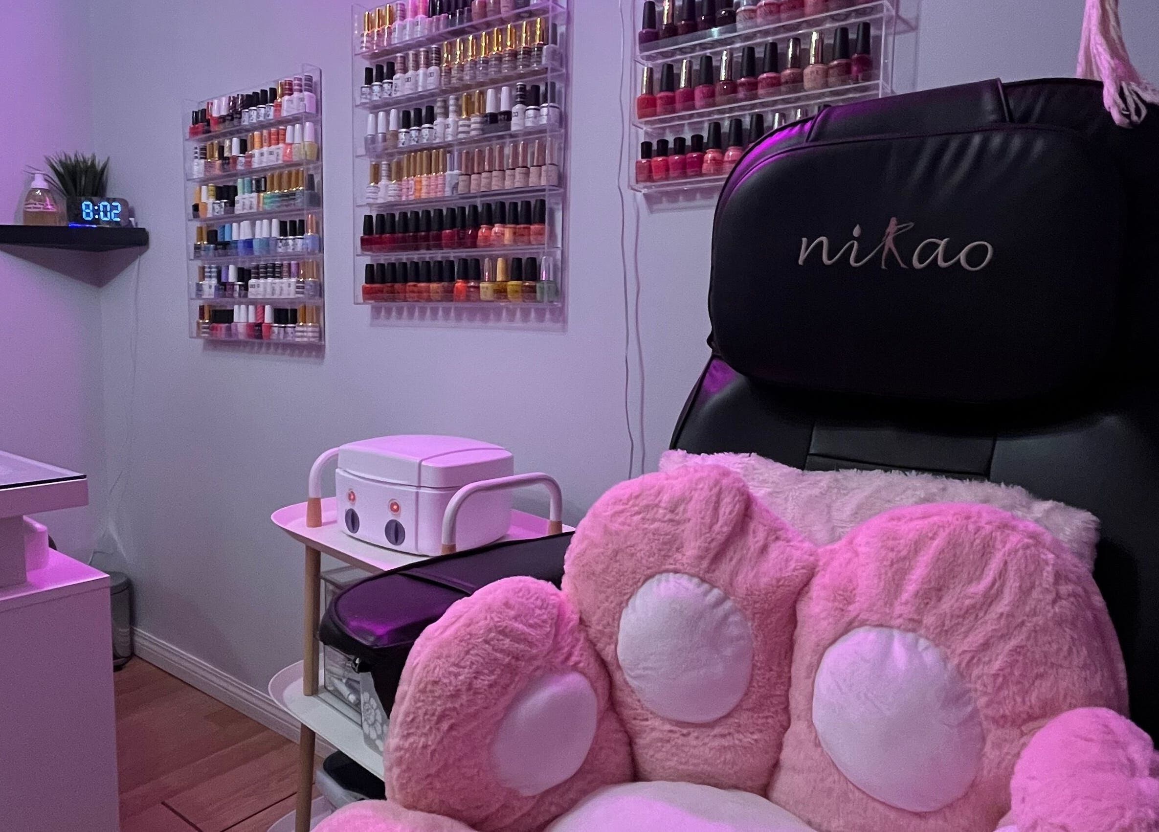 Cozy nail care station at Esthetics by Lyss, Nanaimo, British Columbia, CA, with colorful polish display.
