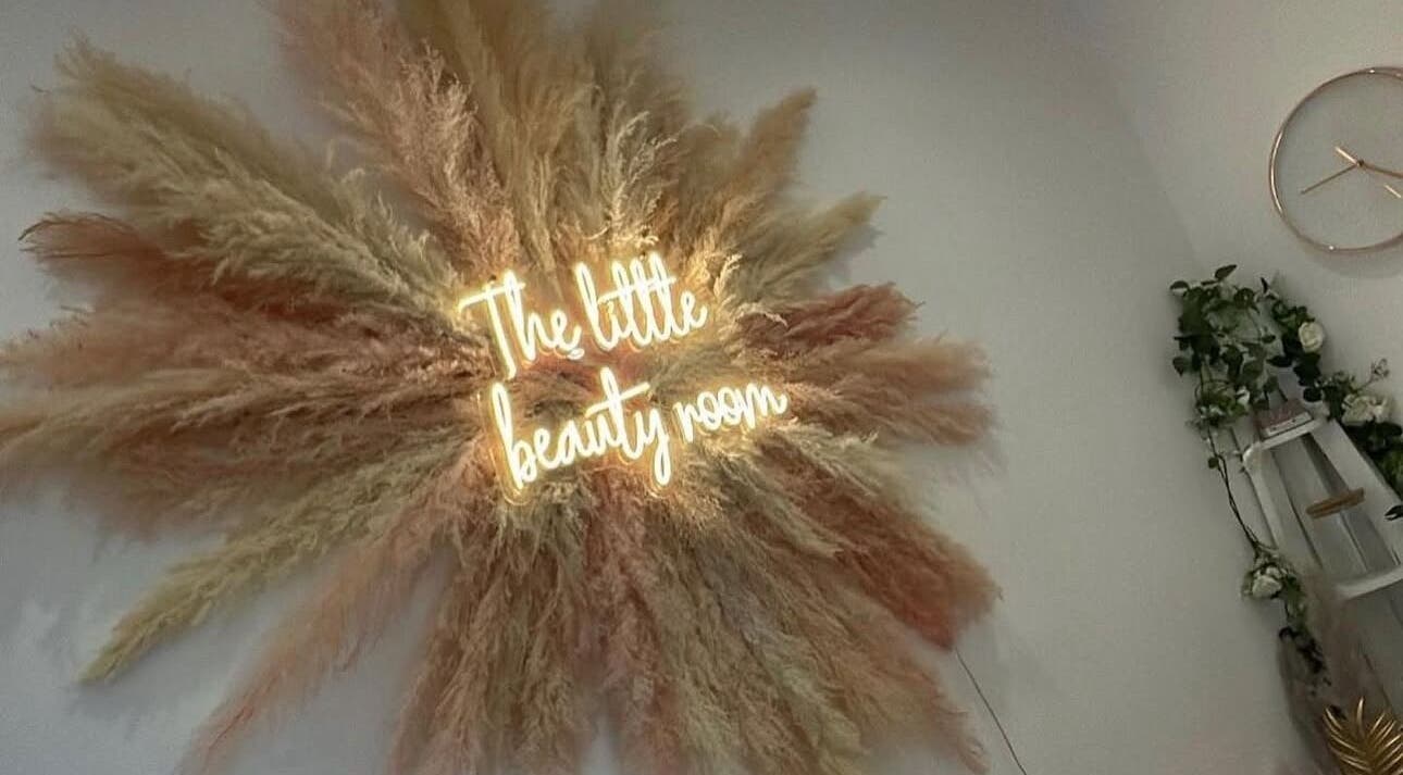 Elegant pampas grass decor and glowing sign at The Little Beauty Room, Bowburn, England, GB.