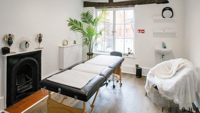 Serene treatment room at Forfacesakeuk, HIGH WYCOMBE, England, GB, with massage table and relaxing decor.