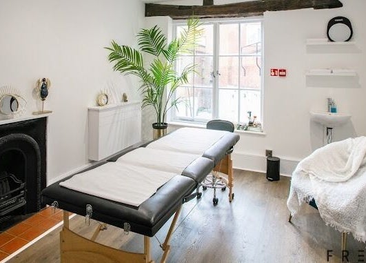 Serene treatment room at Forfacesakeuk, HIGH WYCOMBE, England, GB, with massage table and relaxing decor.