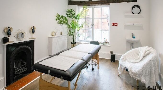 Serene treatment room at Forfacesakeuk, HIGH WYCOMBE, England, GB, with massage table and relaxing decor.