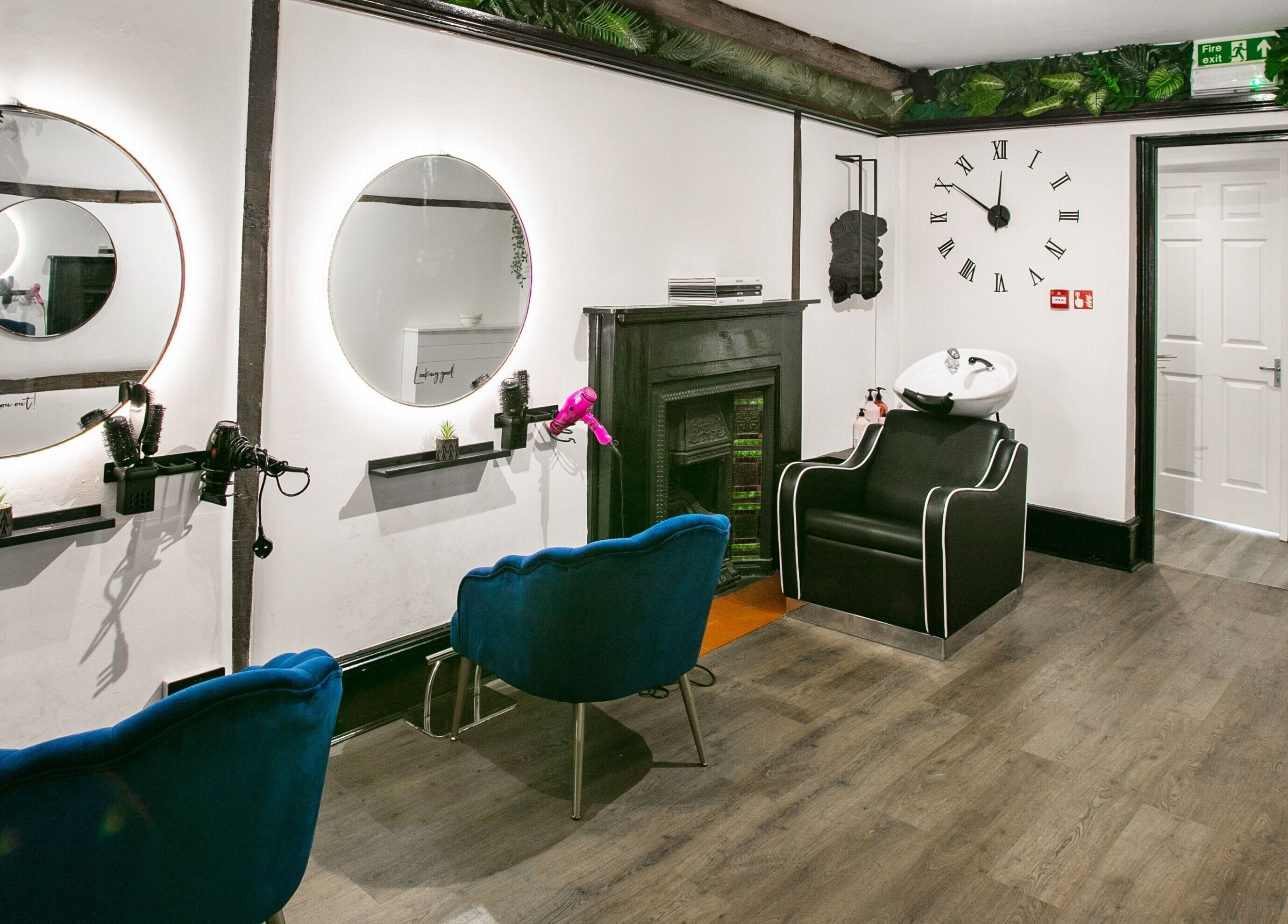 Elegant beauty salon interior at Forfacesakeuk, HIGH WYCOMBE, England, GB, showcasing styling stations and decor.