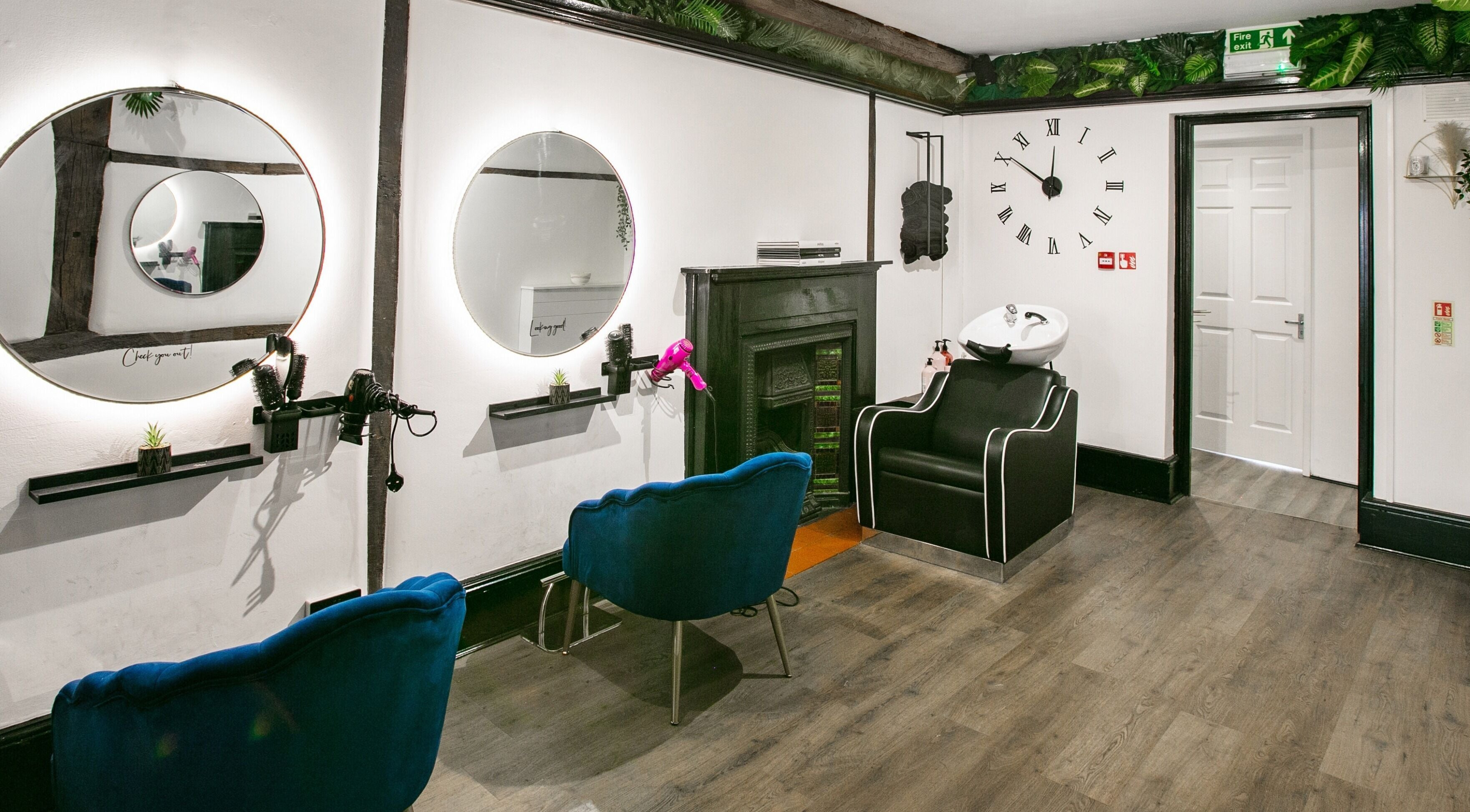 Elegant beauty salon interior at Forfacesakeuk, HIGH WYCOMBE, England, GB, showcasing styling stations and decor.
