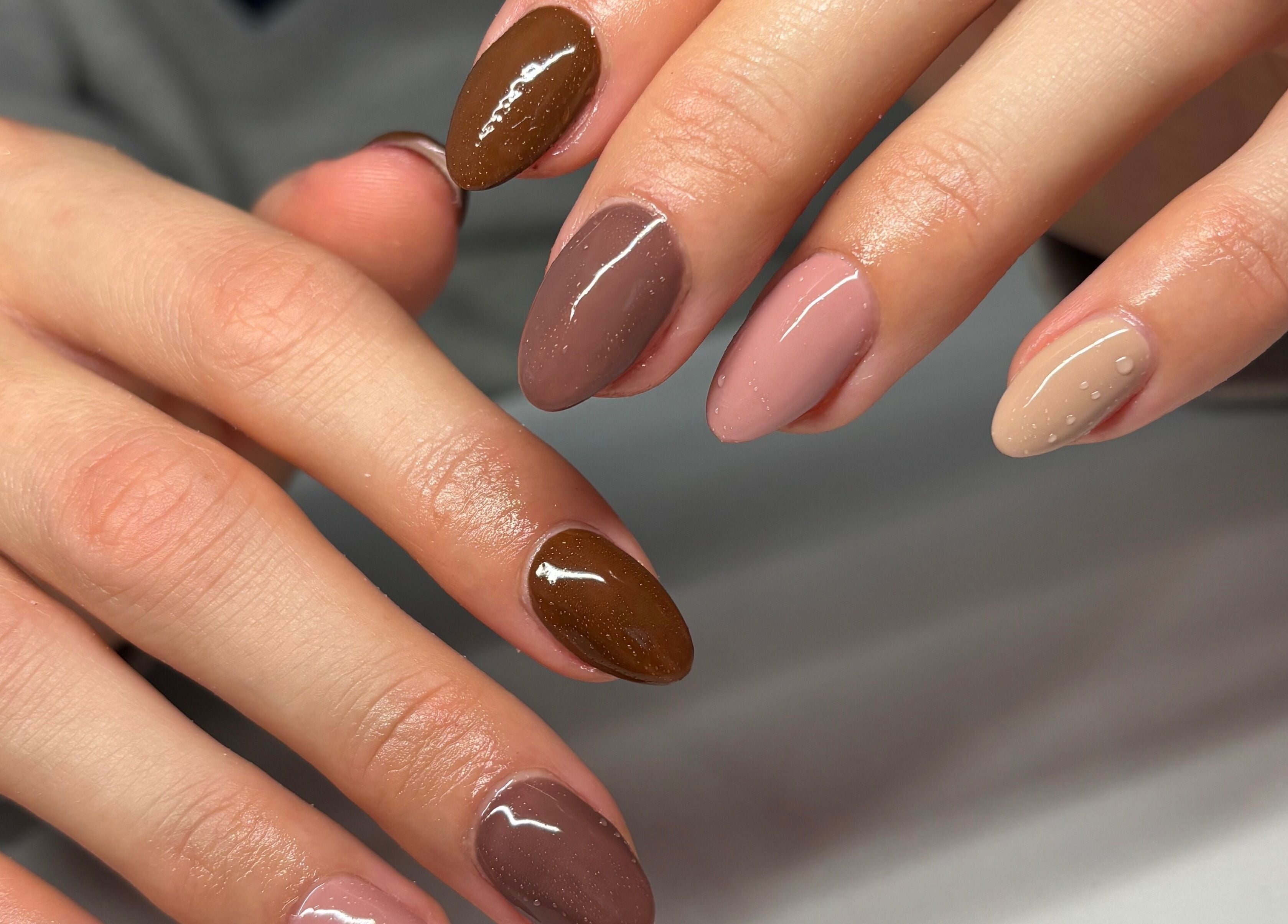 Elegant manicure with earthy tones at Nails by Em, Gloucester, England, GB.
